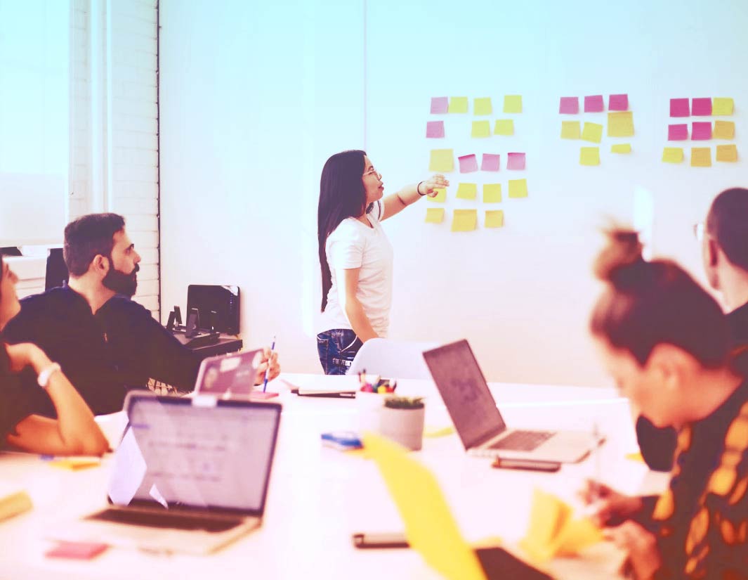 Whiteboard planning session with sticky notes