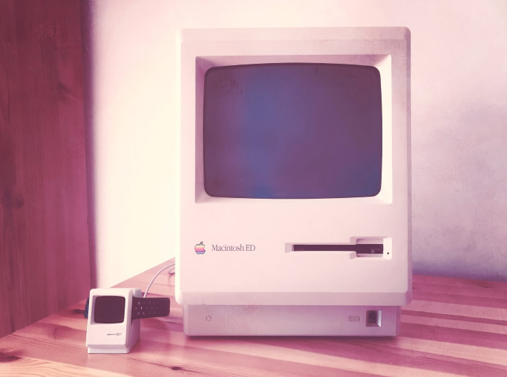 Vintage Macintosh computer on a desk